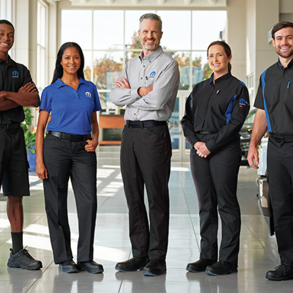 a team of auto dealership workers wearing branded MOPAR Red Kap workwear